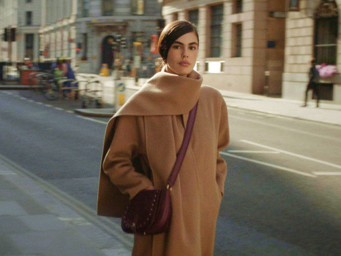 woman in brown coat - ted baker poster