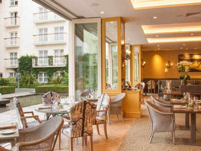 empty hotel restaurant looking out onto courtyard