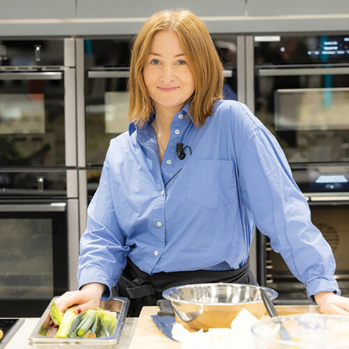 kitty coles standing in kitchen. featured oimage for the gloss 'in the autumn kitchen event'