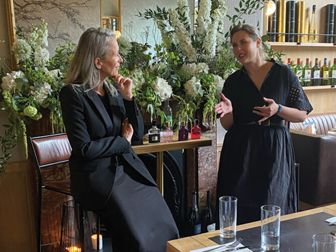 sarah halliwell and rachel freeman talking to each other in a restaurant environment for gloss.ie event
